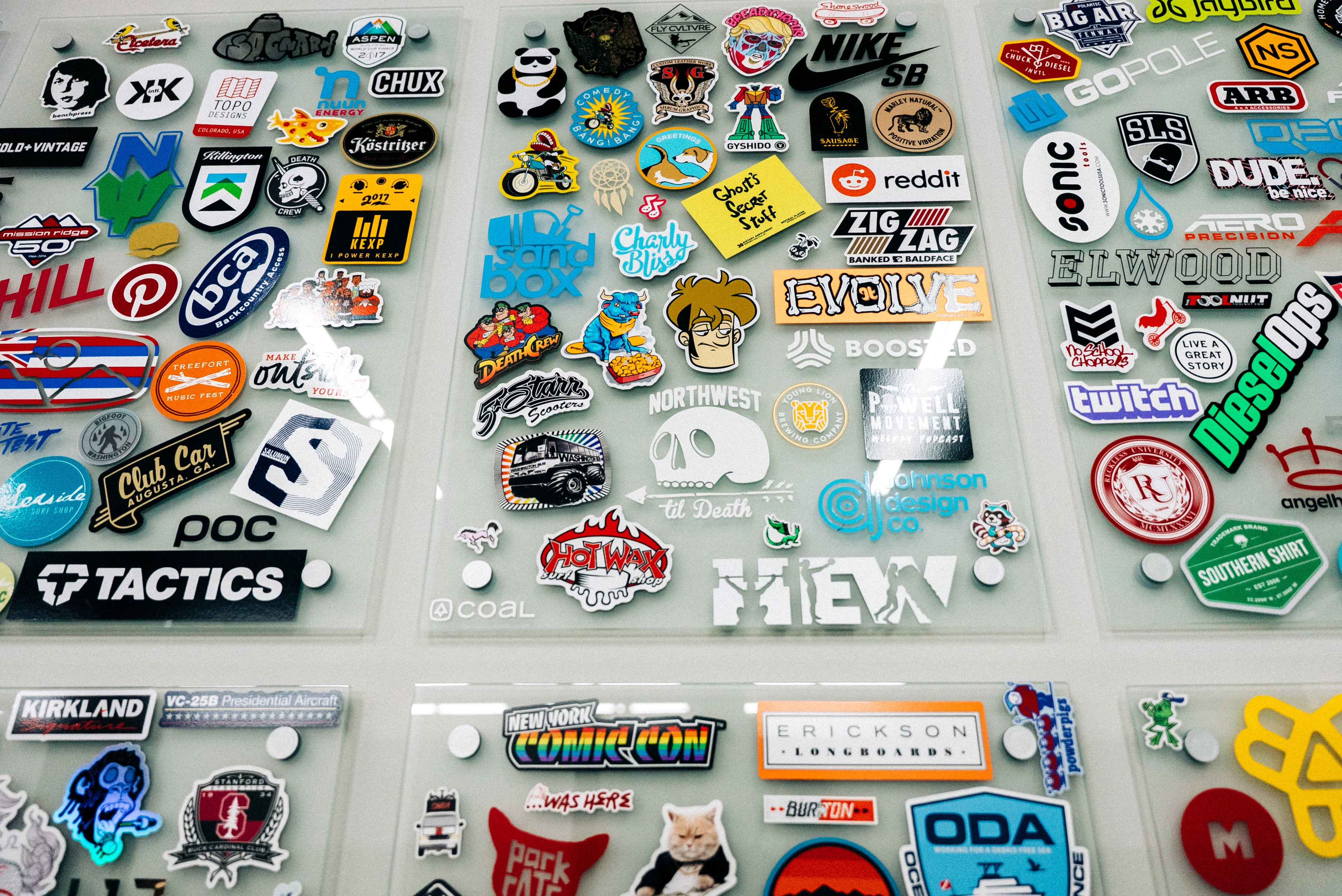 Collection of various stickers with different logos and designs on a white background